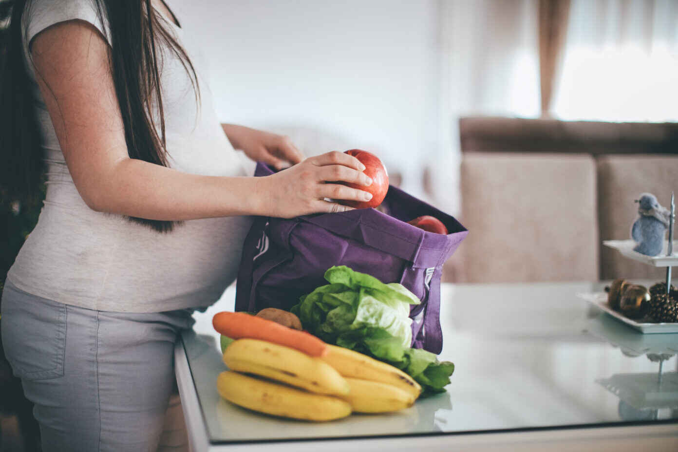 Pregnant woman with Groceries